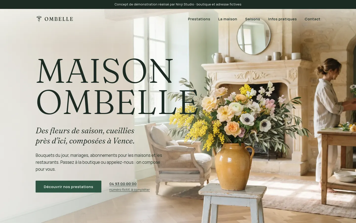 Maison Ombelle : grand titre serif sur une composition de mimosa devant une cheminée de pierre.